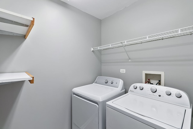 laundry room with washer and dryer and laundry area