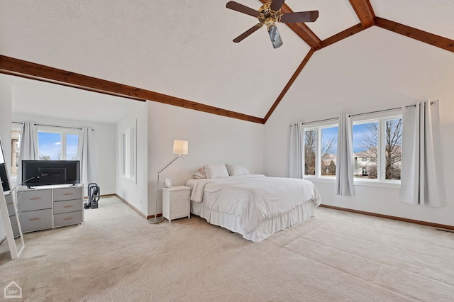 bedroom featuring a ceiling fan, baseboards, light carpet, a textured ceiling, and beamed ceiling