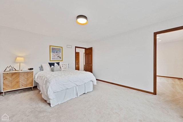 carpeted bedroom featuring baseboards