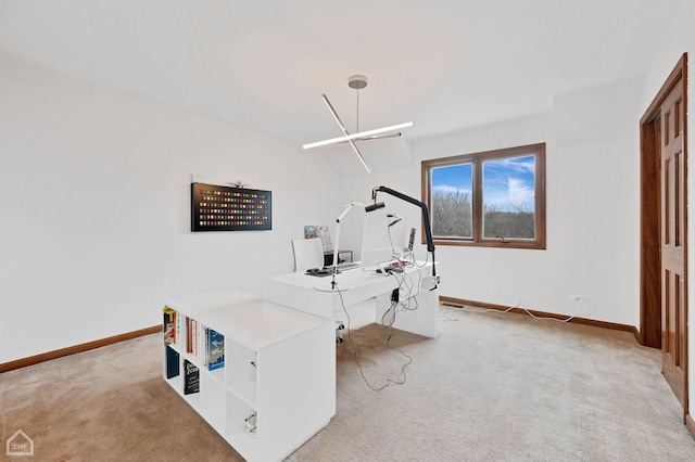 office space featuring baseboards and light colored carpet