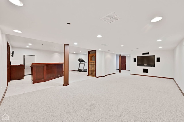 finished basement featuring recessed lighting, visible vents, light carpet, and baseboards