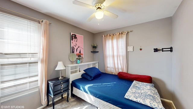 bedroom featuring baseboards and a ceiling fan