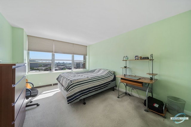 bedroom featuring baseboards and carpet