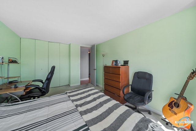 bedroom featuring baseboards and a closet