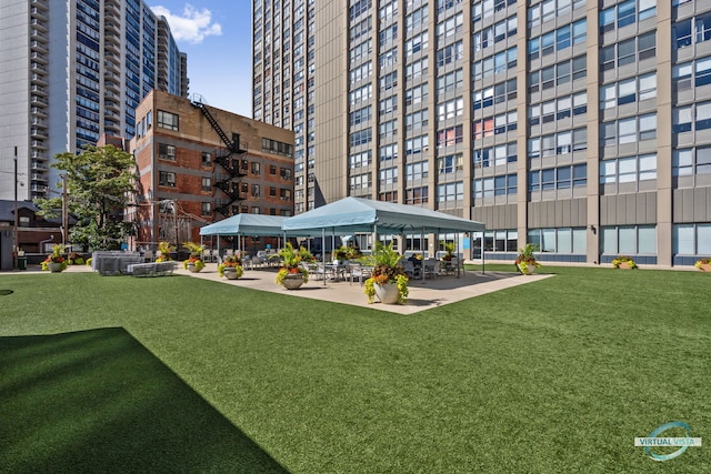 surrounding community with a gazebo and a yard