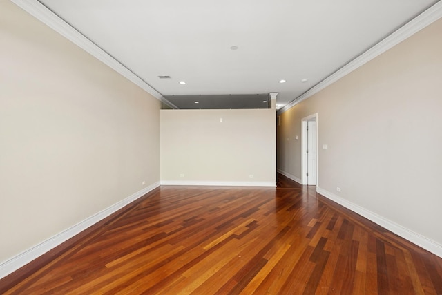 empty room featuring recessed lighting, wood finished floors, visible vents, baseboards, and ornamental molding