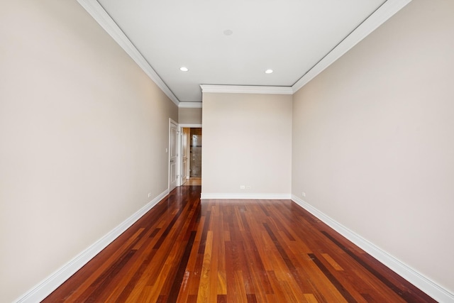 empty room featuring crown molding, recessed lighting, dark wood finished floors, and baseboards