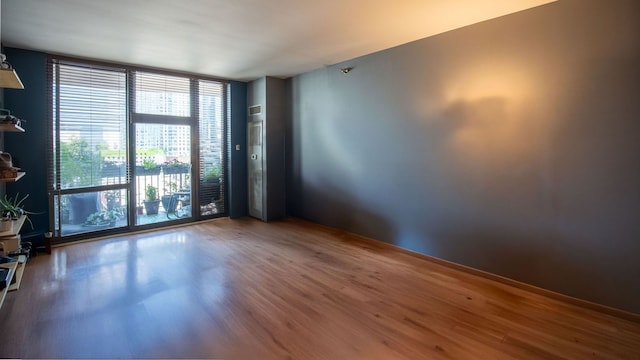 330 N Jefferson St Unit 603, Chicago, IL 60661 - spare room featuring floor to ceiling windows and wood finished floors