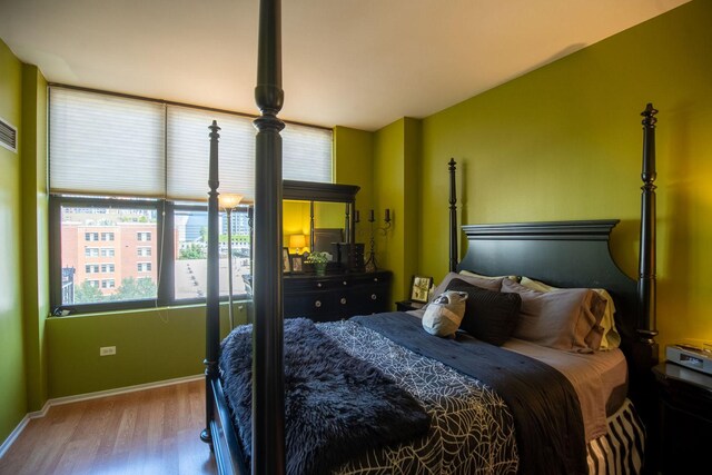 bedroom with a closet and wood finished floors