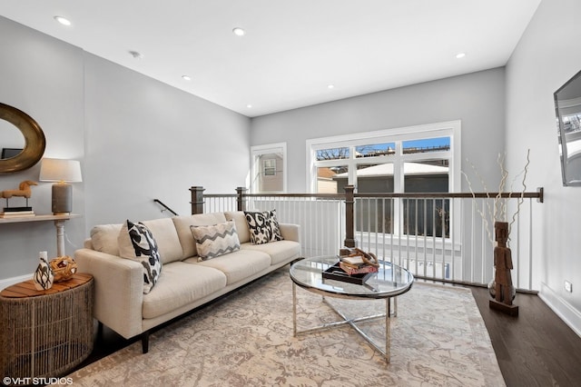 living area featuring recessed lighting, wood finished floors, and baseboards