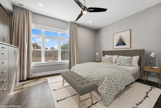 bedroom featuring visible vents, a ceiling fan, wood finished floors, recessed lighting, and baseboards