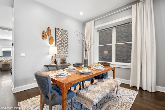 dining area with recessed lighting, baseboards, and wood finished floors