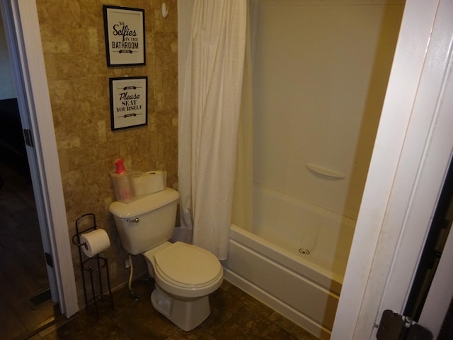full bathroom with toilet, tile patterned flooring, and shower / bath combination with curtain