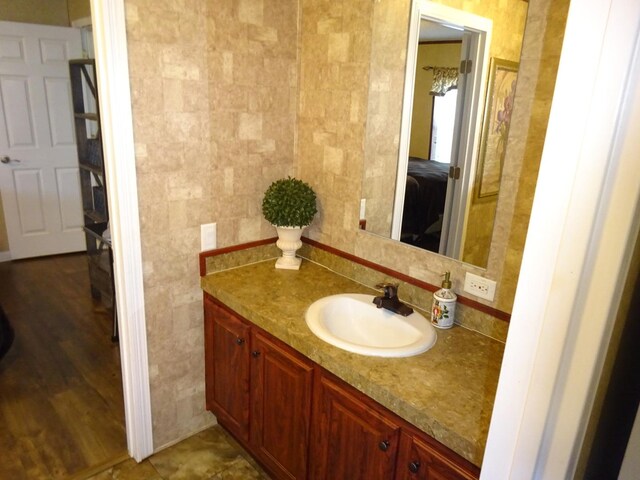 bathroom with tile walls and vanity