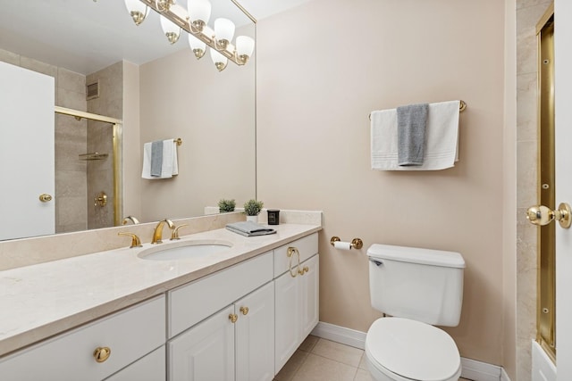 bathroom featuring toilet, tiled shower, tile patterned flooring, baseboards, and vanity