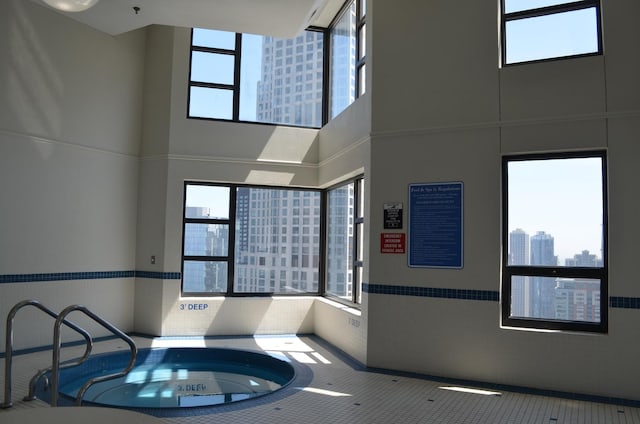 view of swimming pool with a view of city