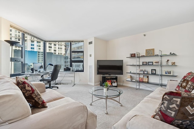 living room featuring a wall of windows, carpet, baseboards, and visible vents