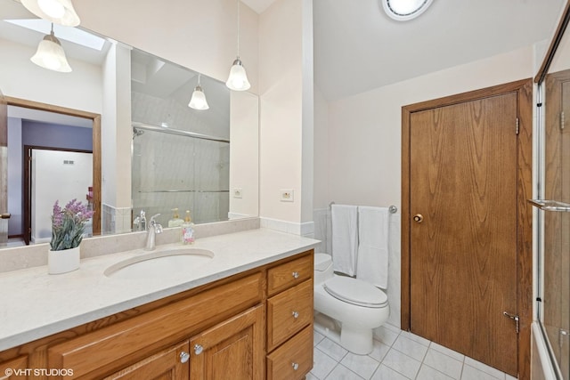 full bath featuring tile patterned flooring, vanity, toilet, and an enclosed shower