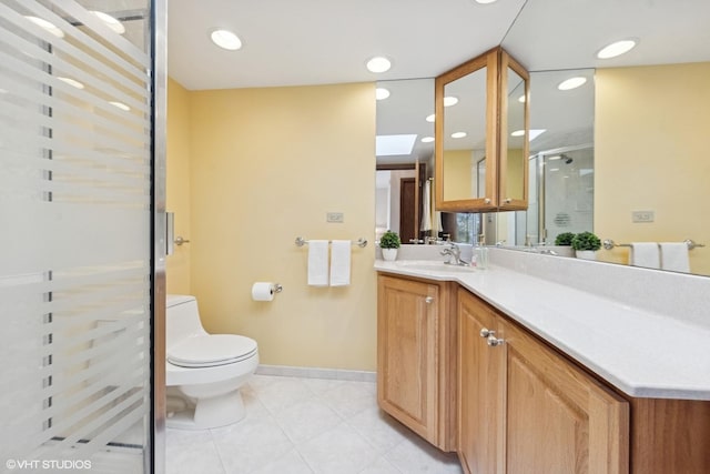 full bathroom featuring baseboards, toilet, tile patterned floors, vanity, and a shower stall