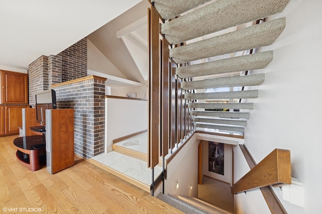 stairway with wood finished floors