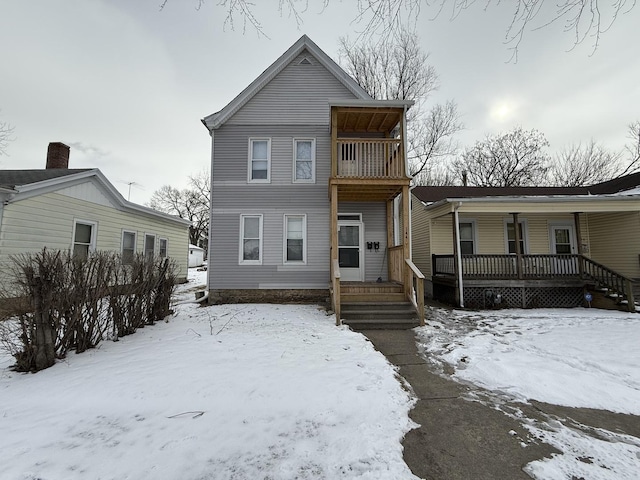 view of front facade with a porch and a balcony