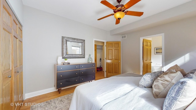 bedroom with visible vents, baseboards, a ceiling fan, light wood-style floors, and a closet