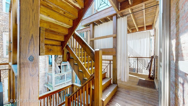 stairs featuring wood-type flooring