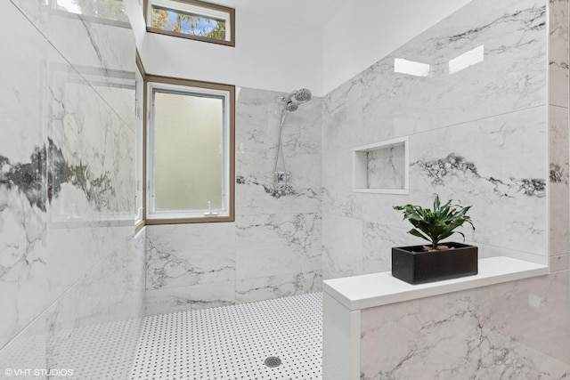 full bathroom featuring tiled shower