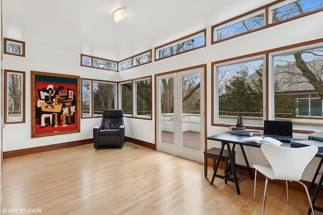 sunroom featuring a wealth of natural light and french doors