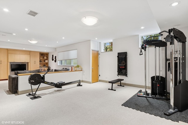 exercise area with recessed lighting, light carpet, visible vents, and baseboards