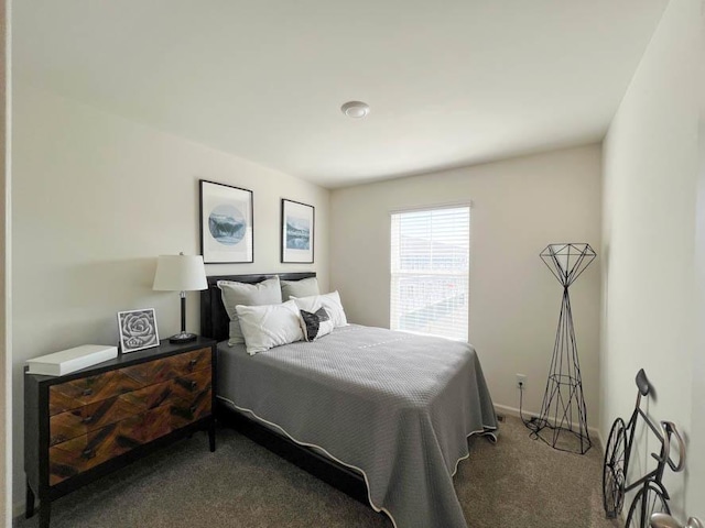 bedroom with carpet floors and baseboards