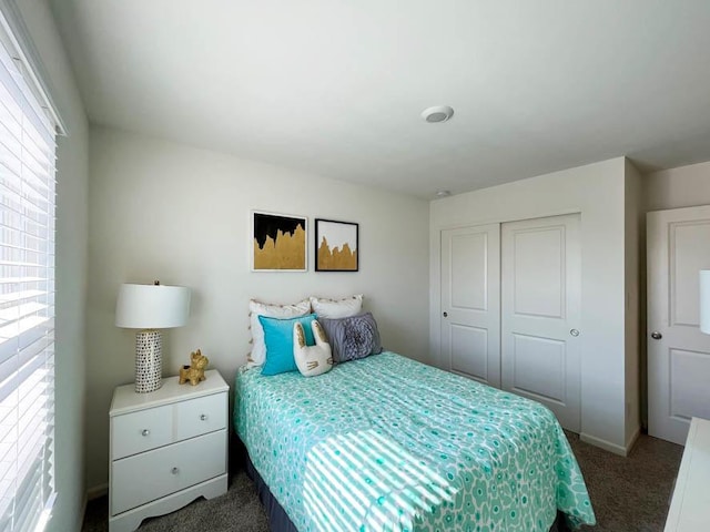 bedroom with carpet floors and a closet