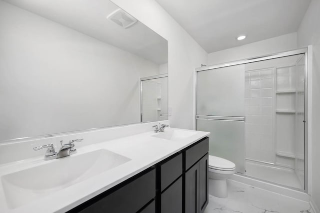 bathroom featuring marble finish floor, a sink, toilet, and a shower stall