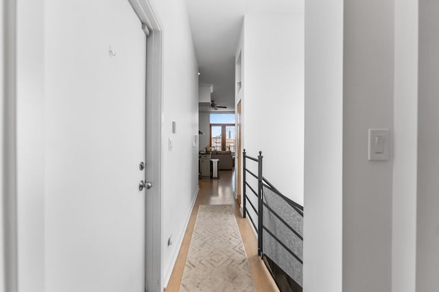 hallway featuring light wood-style flooring