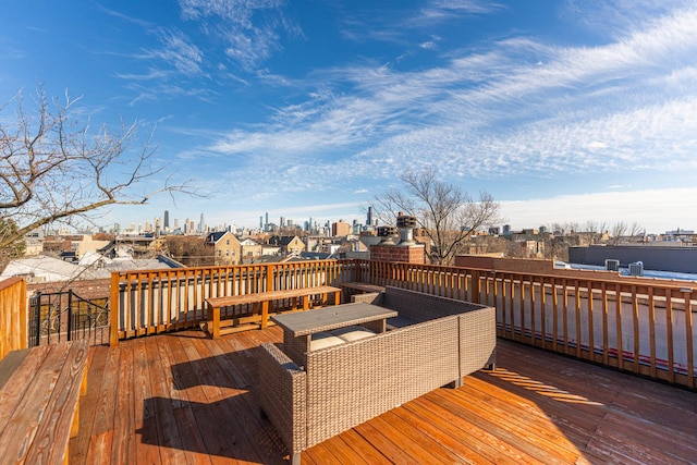 wooden deck with a city view