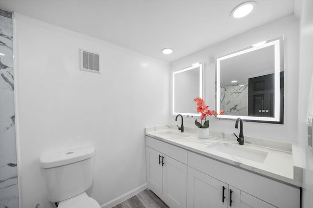 full bathroom featuring toilet, a marble finish shower, a sink, and visible vents