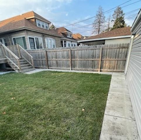 view of yard with a fenced backyard