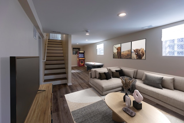 living room with recessed lighting, wood finished floors, visible vents, and stairs