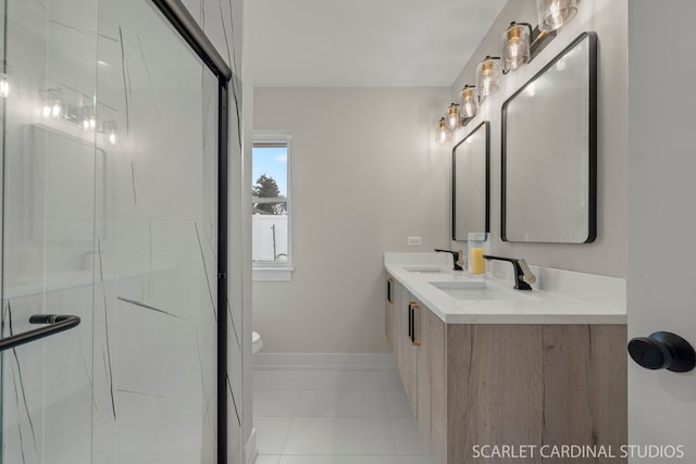 bathroom featuring a sink, a shower stall, toilet, and tile patterned floors