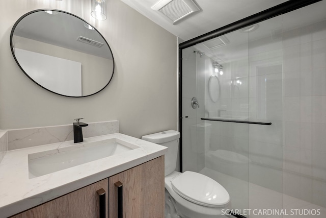 full bathroom with toilet, vanity, a shower stall, and visible vents