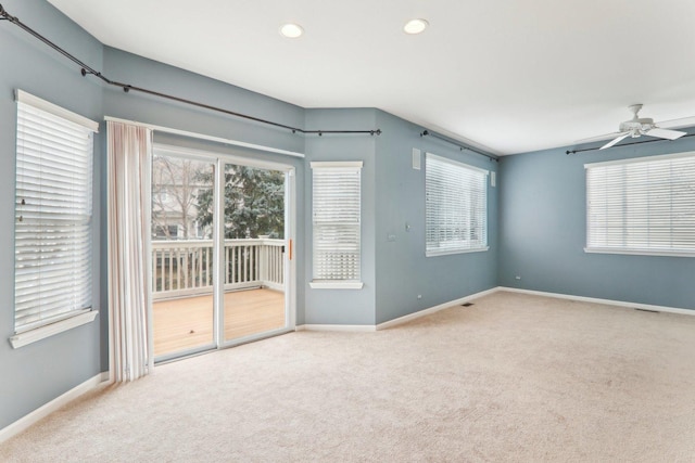 carpeted empty room featuring baseboards, a ceiling fan, and recessed lighting