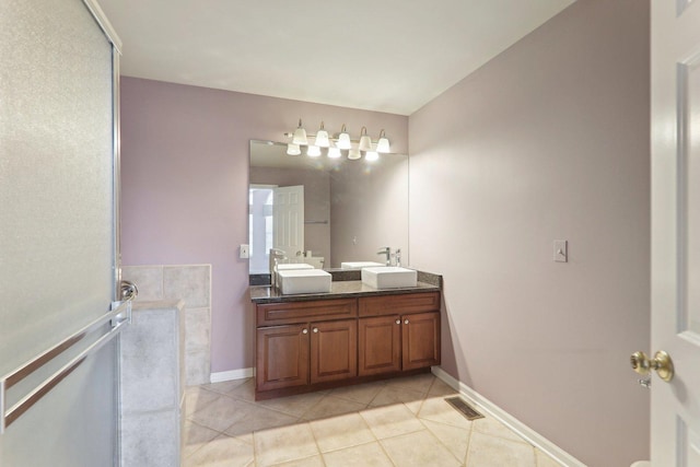 full bath featuring tile patterned floors, visible vents, a sink, and double vanity