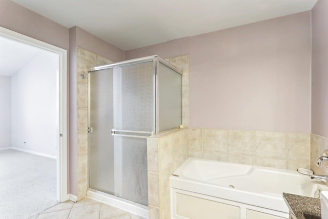 bathroom featuring a stall shower, tile patterned flooring, and a bath