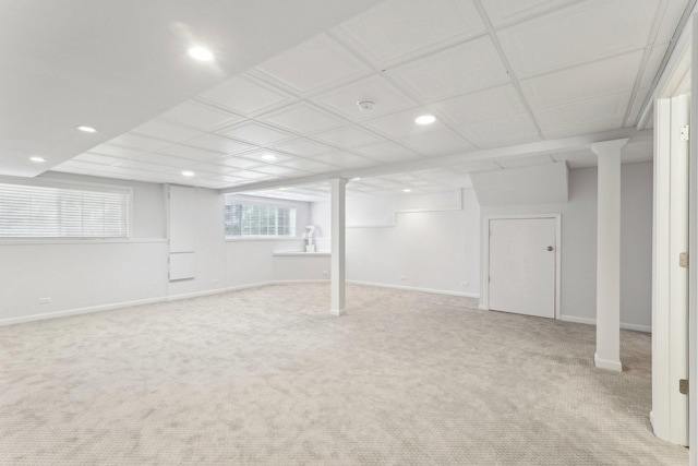 basement with light carpet, baseboards, and recessed lighting