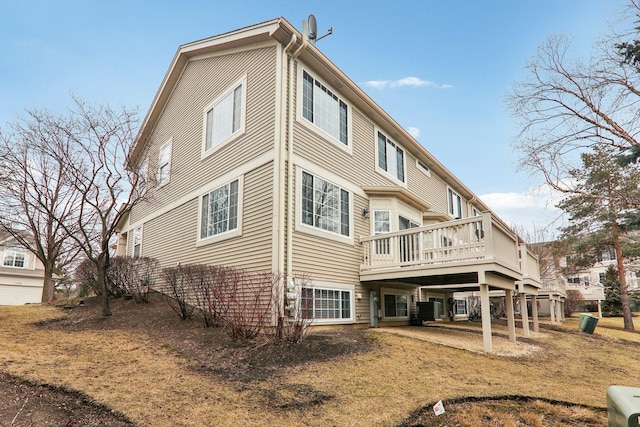 back of property featuring a deck