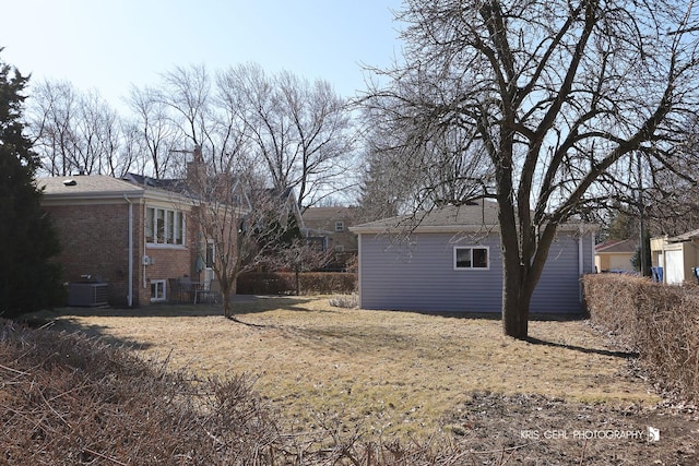 view of yard featuring central air condition unit