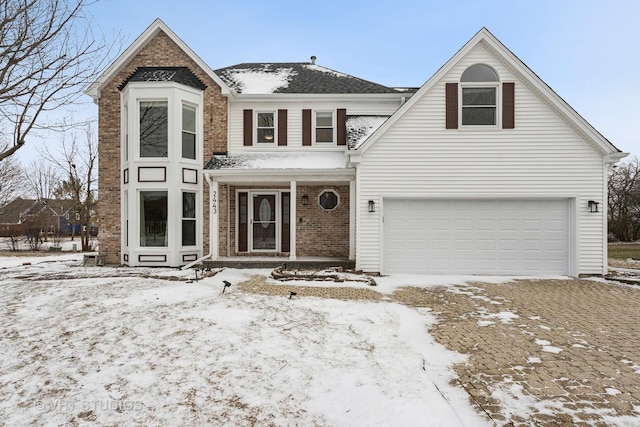 traditional home with covered porch and brick siding