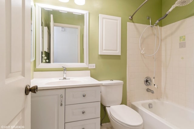 full bathroom featuring bathtub / shower combination, vanity, and toilet