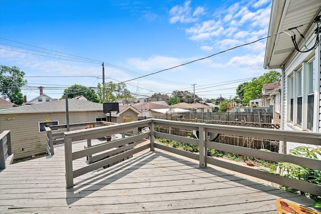 wooden deck featuring fence and a residential view