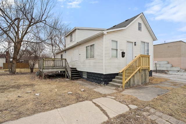 exterior space featuring a wooden deck